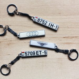 three keychains with the number five and the number five on them